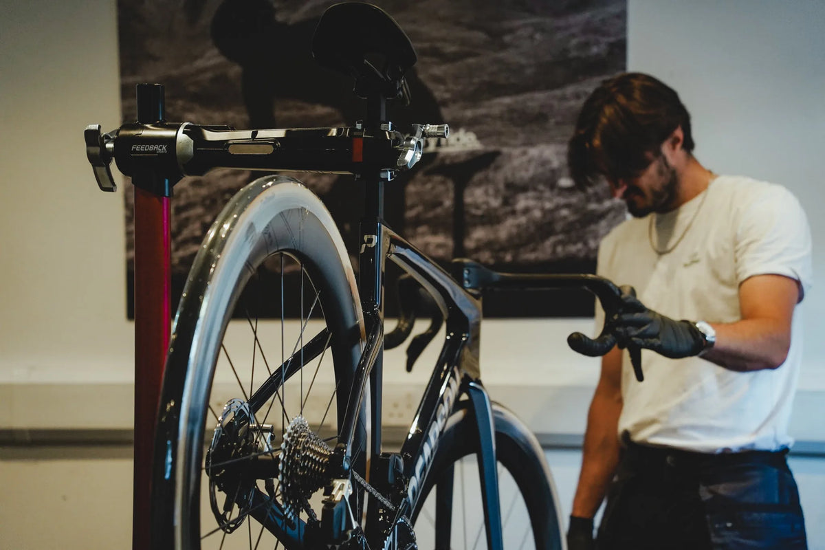 A Pearson mechanic setting up a bike in the workshop